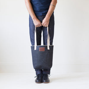 angle hover: denim | Raleigh Denim Workshop denim tote bag with cream handles and leather patch